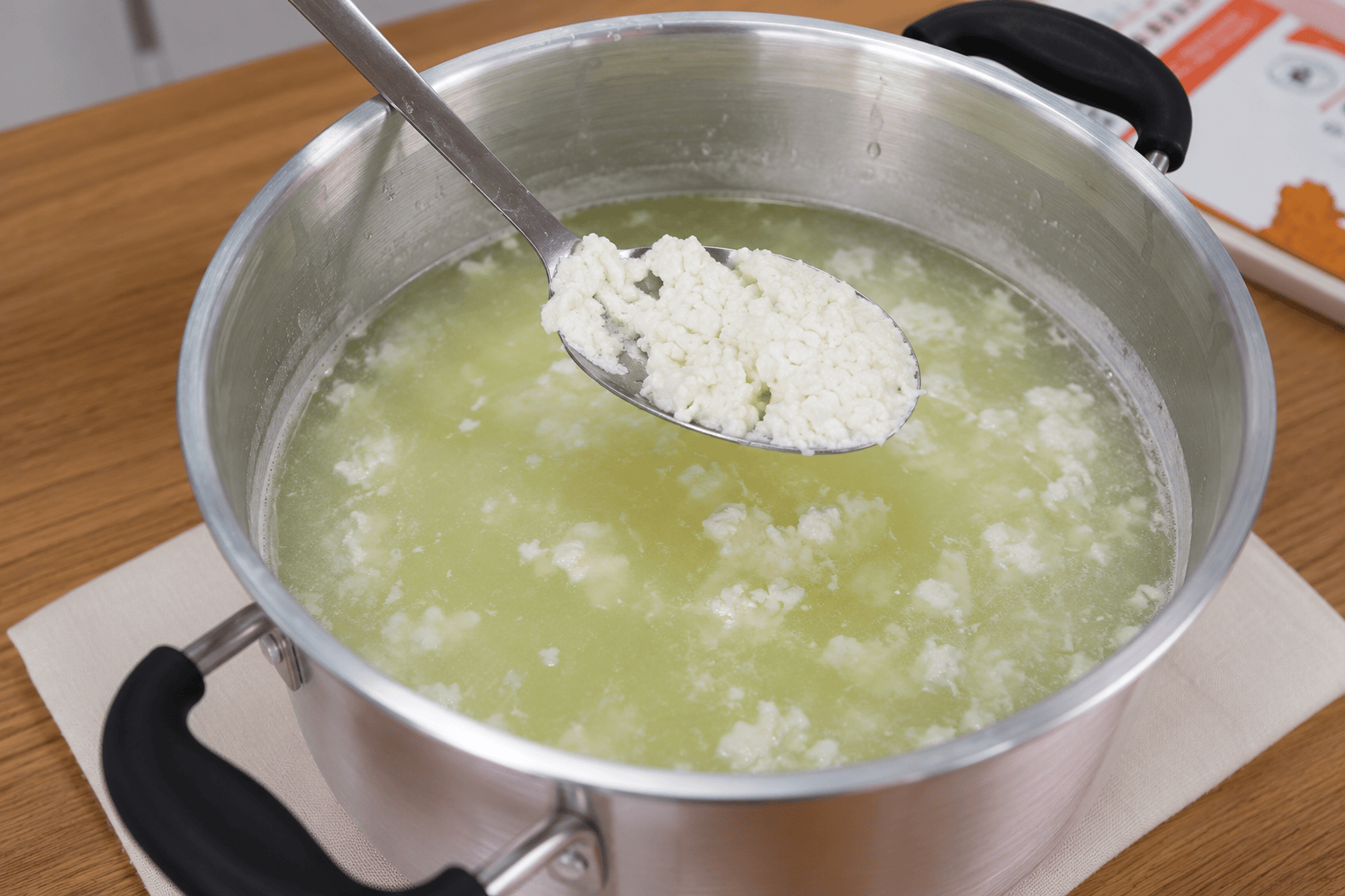 Curds stirred off heat