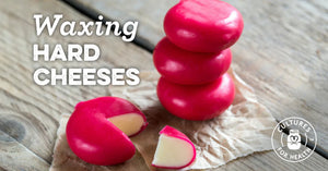 Waxing hard cheeses