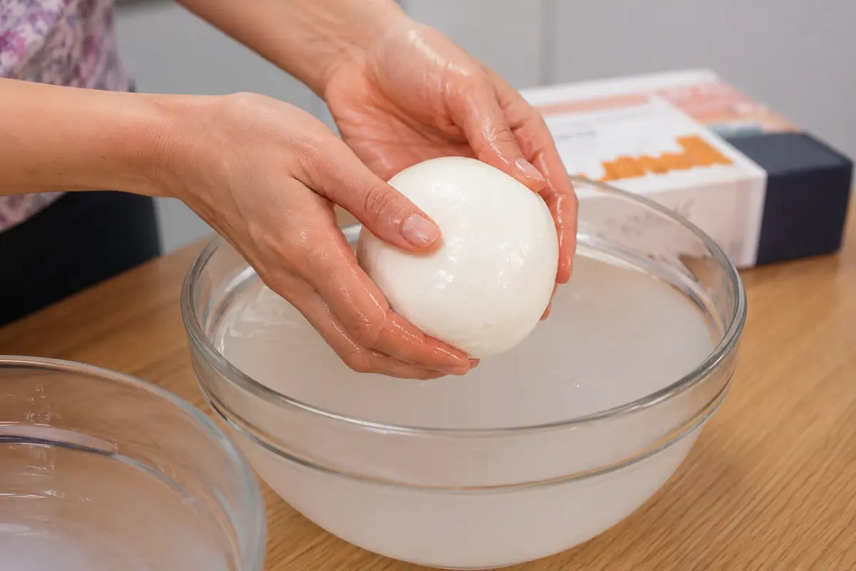 Mozzarella shaped into a smooth ball