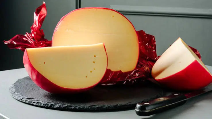 Red wax coating on a homemade cheese wheel